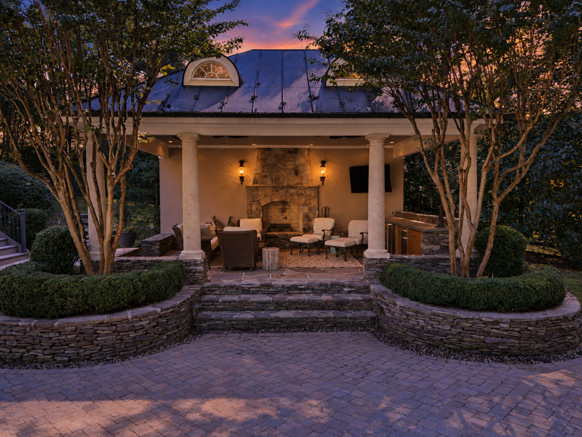 3002 Applebrook Ln — Covered pavilion with stone fireplace at twilight